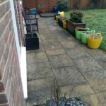 Rear garden with old patio slabs before rip out